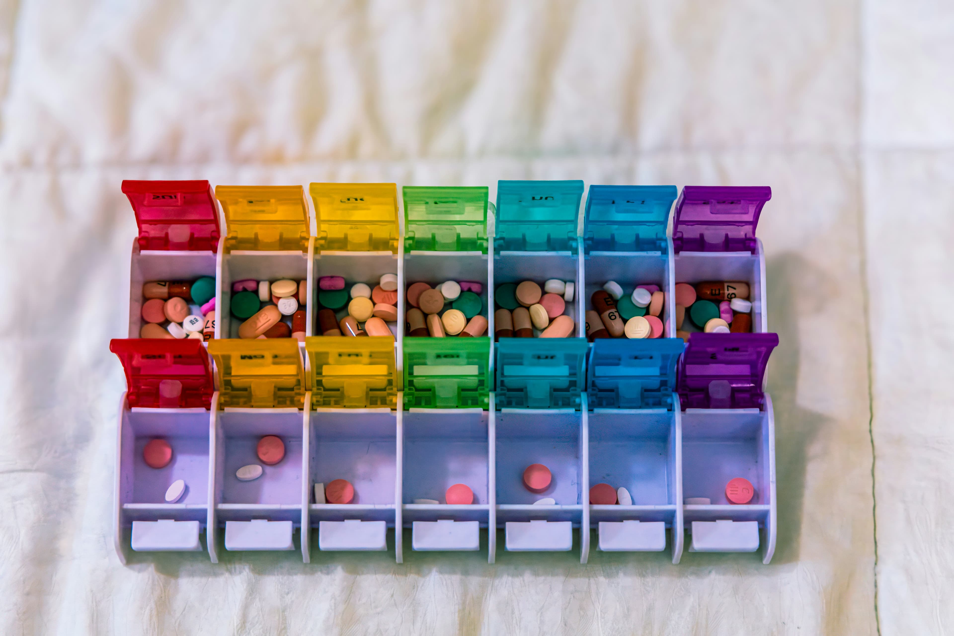 Weekly pill organizer with assorted medications